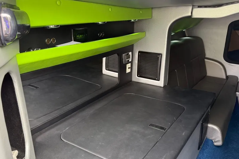 Slide: The Image of Interior of a 2002 Fountain 42 Lightning boat with modern design and green accents. - 16