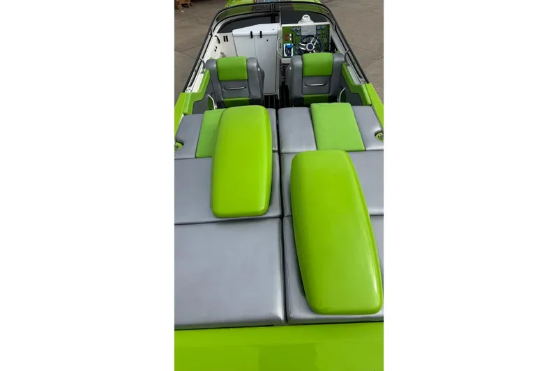 Slide: The Image of 2002 Fountain 42 Lightning boat interior with green and gray seating. - 7