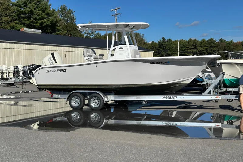 Slide: The Image of 2019 Sea Pro 239 Deep V CC boat on trailer, parked outdoors. - 19