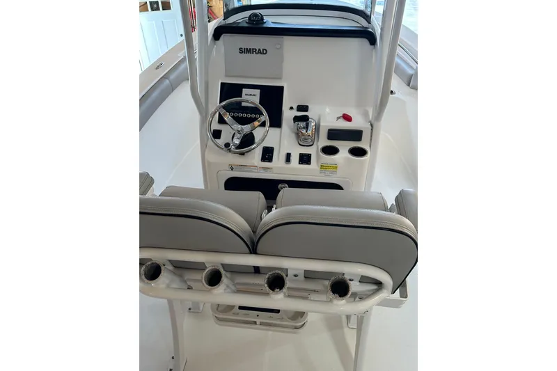 Slide: The Image of 2019 Sea Pro 239 Deep V CC boat console with steering wheel and controls. - 8