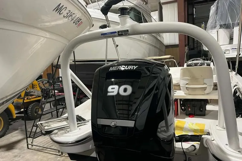 Slide: The Image of 2023 Boston Whaler 160 Super Sport with Mercury 90 engine in storage. - 11