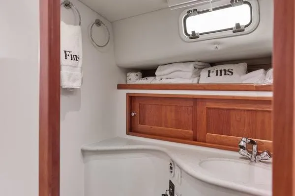 Slide: The Image of Luxurious bathroom interior of 2018 MJM 40z yacht with wooden cabinets and towels. - 10