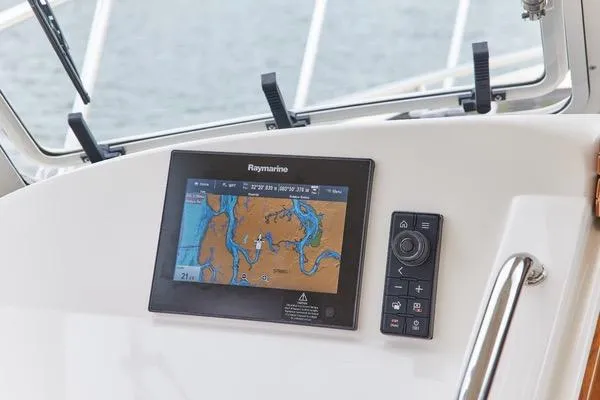 Slide: The Image of Raymarine navigation system on 2018 MJM 40z boat dashboard, displaying nautical map. - 14