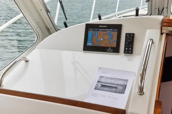 Slide: The Image of Helm of 2018 MJM 40z boat with navigation display and document. - 16