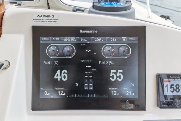 Slide: The Image of Raymarine display on 2018 MJM 40z showing fuel levels and navigation data. - 17