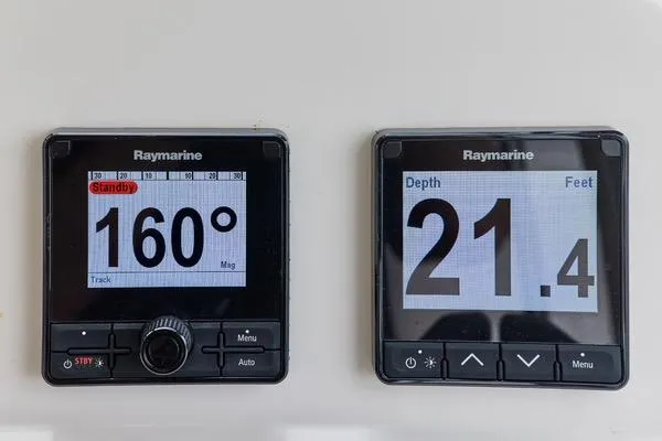 Slide: The Image of Raymarine navigation displays on 2018 MJM 40z, showing heading and depth readings. - 20