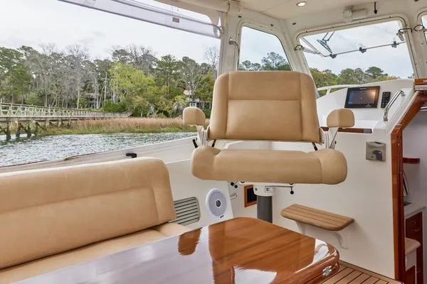 Slide: The Image of Interior of 2018 MJM 40z yacht with beige seating and wooden accents. - 22