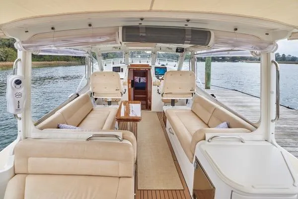 Slide: The Image of Luxurious 2018 MJM 40z yacht interior with beige seating and wooden accents. - 23