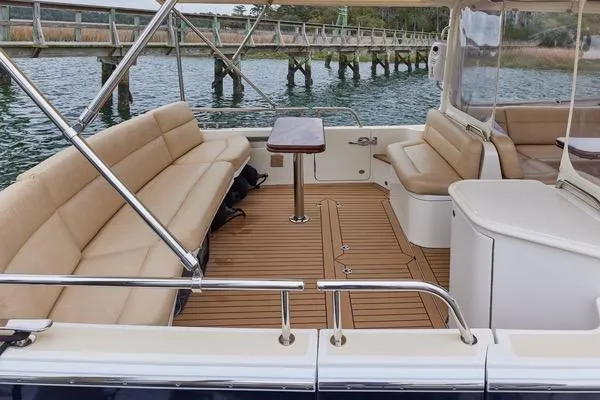 Slide: The Image of Luxurious 2018 MJM 40z yacht interior with beige seating and wooden deck. - 25