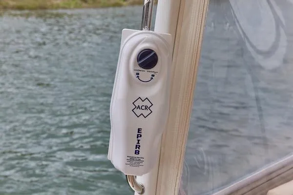 Slide: The Image of EPIRB device on 2018 MJM 40z boat, near water. - 32