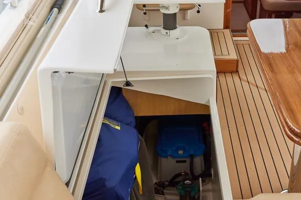 Slide: The Image of 2018 MJM 40z yacht interior with storage compartment and wooden flooring. - 35