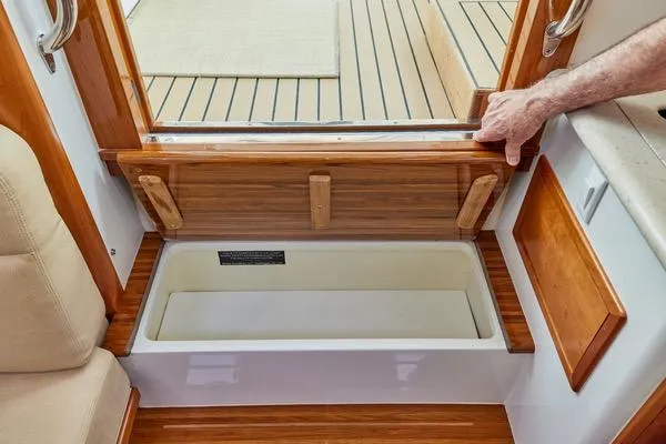 Slide: The Image of Interior view of 2018 MJM 40z boat with wooden storage compartment. - 39