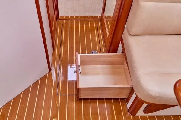 Slide: The Image of Luxury interior of 2018 MJM 40z yacht with wooden flooring and storage drawer. - 7