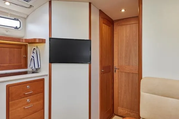 Slide: The Image of Interior of 2018 MJM 40z yacht with wood cabinetry and mounted TV. - 8