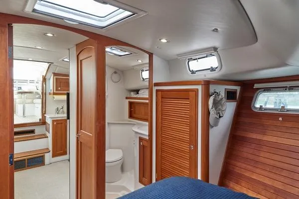 Slide: The Image of Interior of 2018 MJM 40z yacht featuring wood accents and modern amenities. - 9