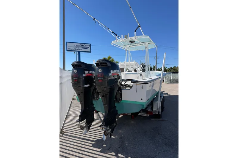 Slide: The Image of 2005 Albury Brothers 23 boat with dual Suzuki 140 outboard motors on a trailer. - 10