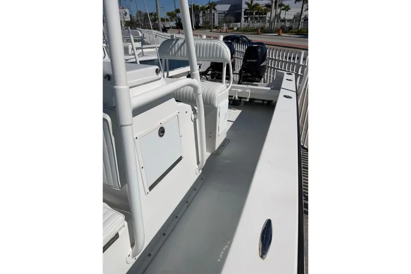 Slide: The Image of 2005 Albury Brothers 23 boat interior with seating and dual engines. - 4