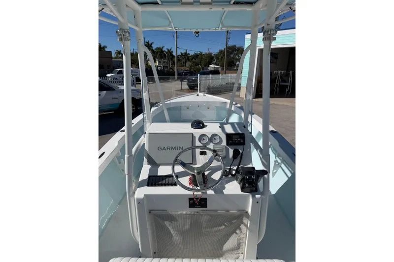 Slide: The Image of 2005 Albury Brothers 23 boat interior with Garmin navigation system and steering wheel. - 5