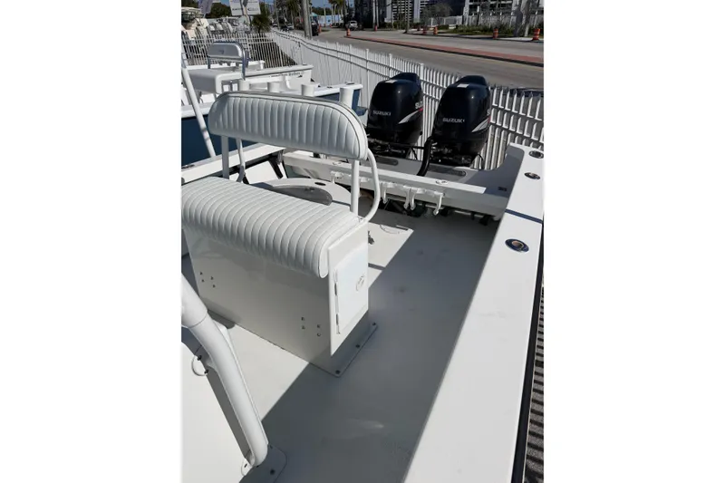 Slide: The Image of 2005 Albury Brothers 23 boat with dual Suzuki outboard engines and cushioned seating. - 7