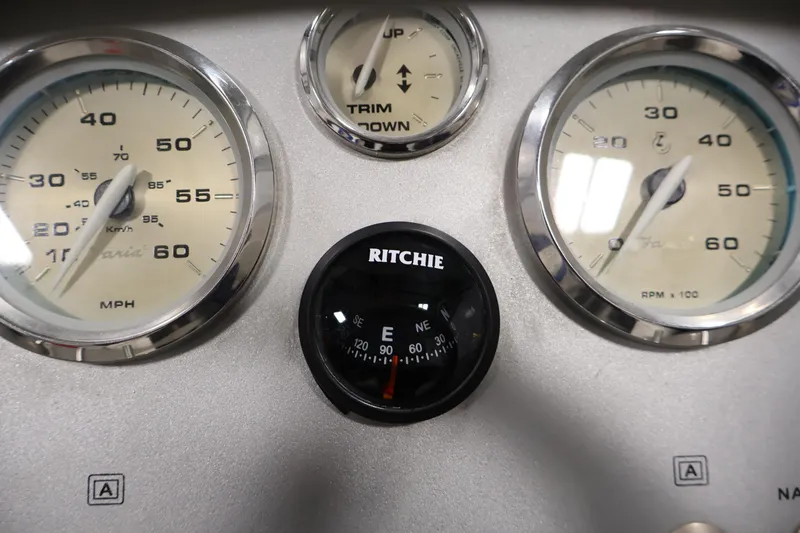Slide: The Image of Dashboard of a 2006 Bayliner 195 Bowrider with speedometer, tachometer, and compass. - 18