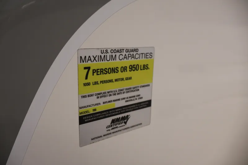 Slide: The Image of 2006 Bayliner 195 Bowrider capacity label, 7 persons or 950 lbs, U.S. Coast Guard compliant. - 21