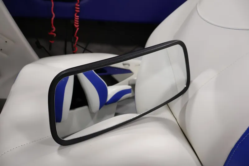 Slide: The Image of Interior of 2006 Bayliner 195 Bowrider with white and blue seating. - 27