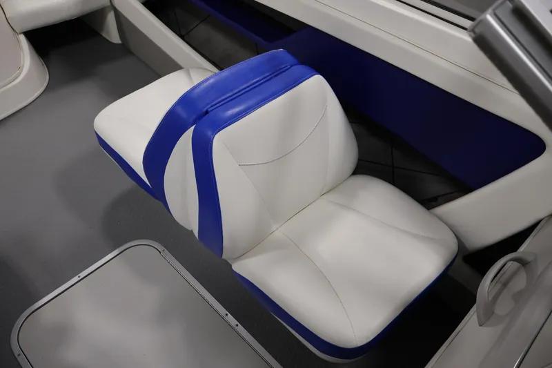 Slide: The Image of 2006 Bayliner 195 Bowrider interior with white and blue seating. - 28