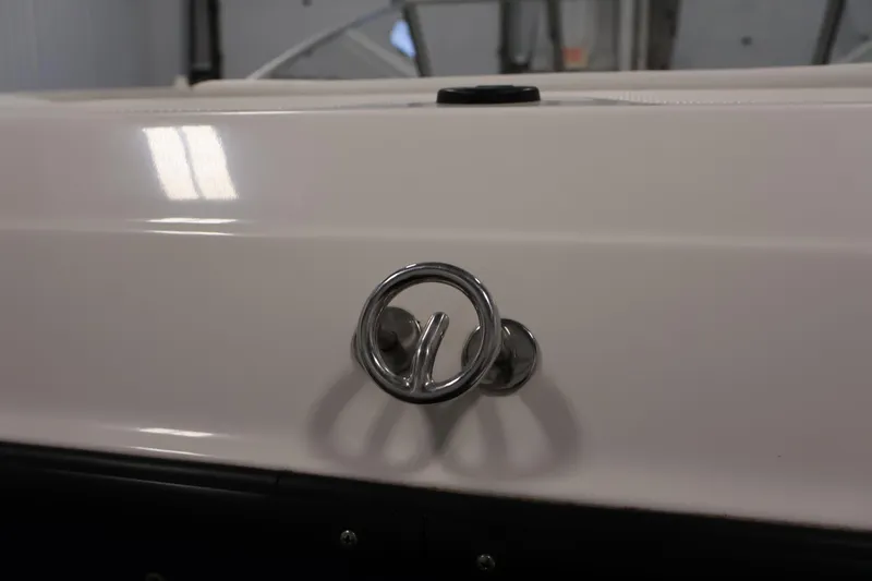 Slide: The Image of 2006 Bayliner 195 Bowrider boat detail with chrome cleat in indoor setting. - 39
