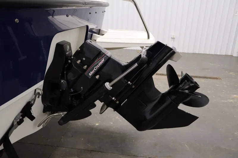 Slide: The Image of 2006 Bayliner 195 Bowrider with MerCruiser outboard motor in a garage setting. - 41