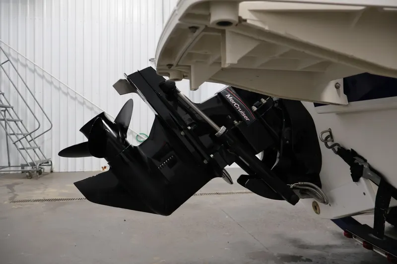 Slide: The Image of 2006 Bayliner 195 Bowrider with MerCruiser outboard motor in a garage setting. - 42