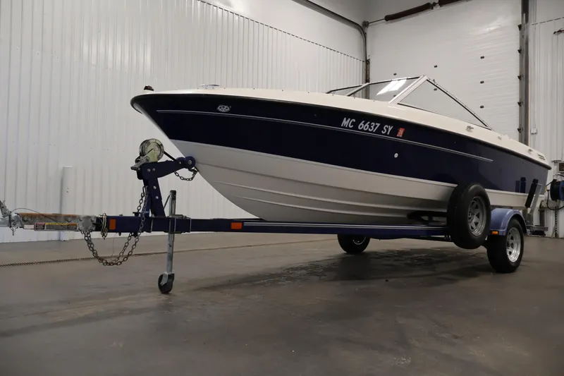 Slide: The Image of 2006 Bayliner 195 Bowrider on trailer in indoor storage facility. - 47