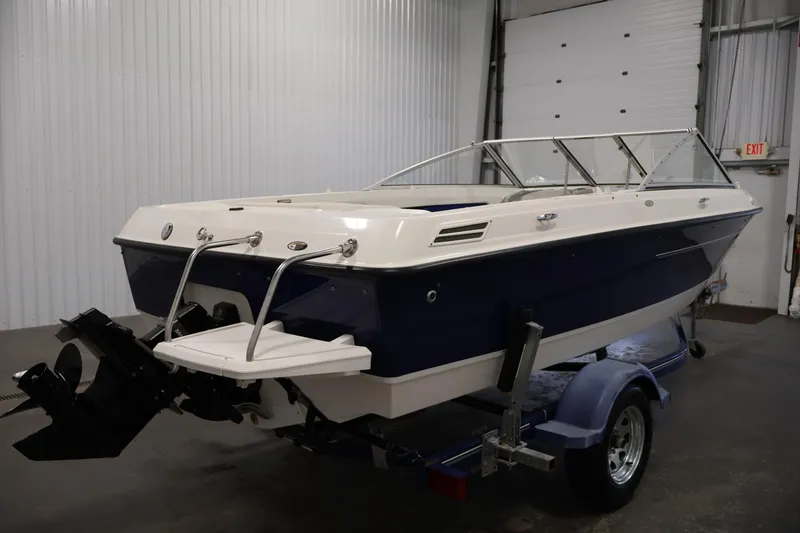 Slide: The Image of 2006 Bayliner 195 Bowrider boat on trailer in indoor storage facility. - 5