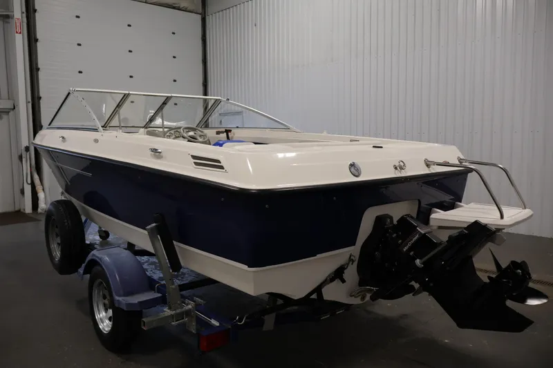 Slide: The Image of 2006 Bayliner 195 Bowrider boat on trailer in indoor storage facility. - 7