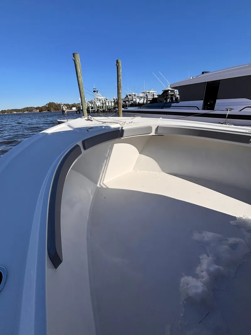 Slide: The Image of Parker 23 Special Edition 2025 boat docked under sunny skies. - 9