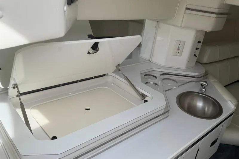 Slide: The Image of Interior of 2000 Fountain 38 Lightning boat with sink and storage compartment. - 16