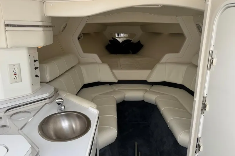 Slide: The Image of 2000 Fountain 38 Lightning boat interior with seating, sink, and bed. - 18