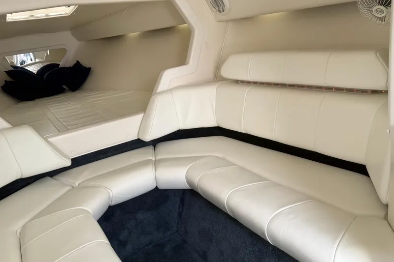 Slide: The Image of Luxurious interior of a 2000 Fountain 38 Lightning boat with white leather seating. - 19