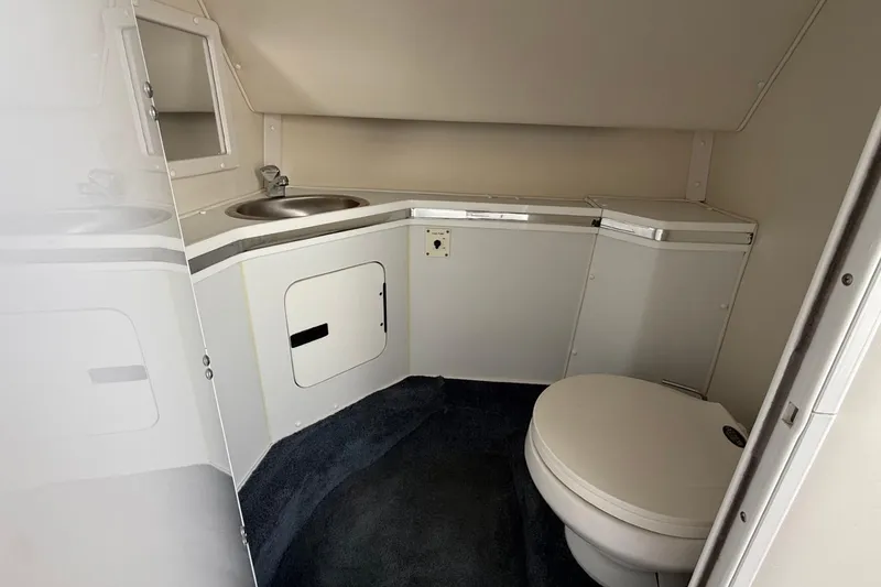 Slide: The Image of Interior of 2000 Fountain 38 Lightning boat bathroom with sink and toilet. - 21