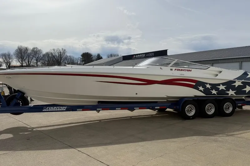 Slide: The Image of 2000 Fountain 38 Lightning speedboat on trailer with patriotic design. - 4