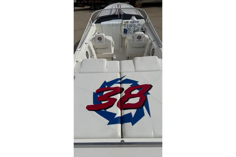 Slide: The Image of 2000 Fountain 38 Lightning boat interior with logo and seating. - 5