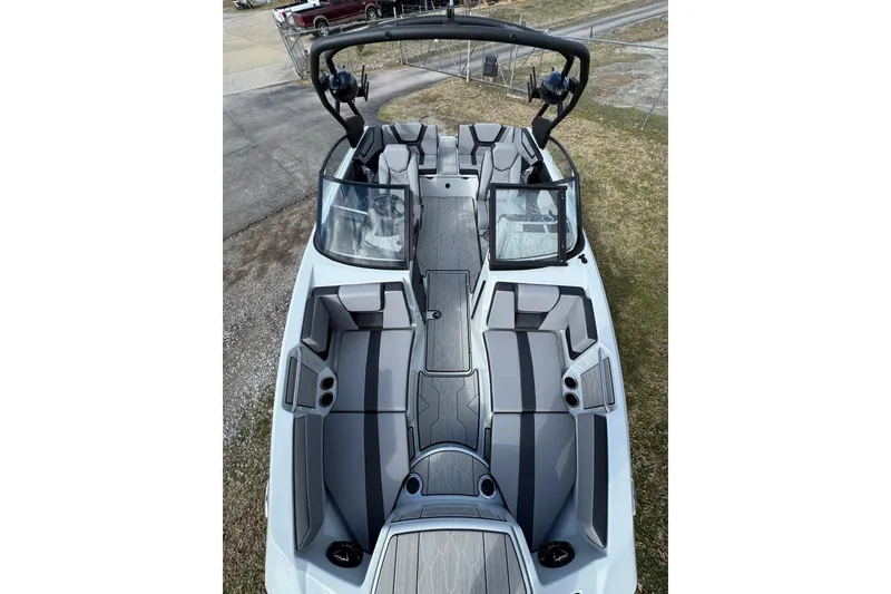 Slide: The Image of 2024 Yamaha Boats 222XE interior, showcasing sleek seating and modern design. - 4