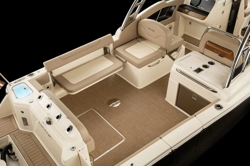 Slide: The Image of 2026 Chris Craft 28 Calypso boat interior with beige seating and modern amenities. - 3