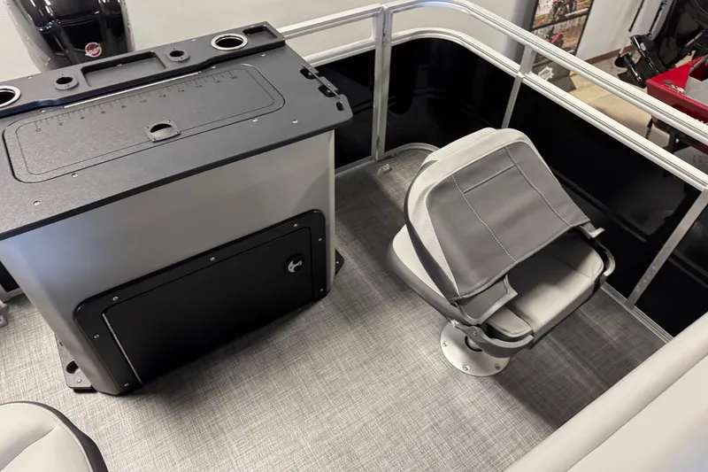 Slide: The Image of 2026 Sun Tracker SportFish 20 DLX interior with seating and storage area. - 13