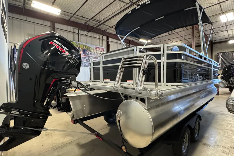 Slide: The Image of 2026 Sun Tracker SportFish 20 DLX pontoon boat with Mercury Pro XS engine in showroom. - 4