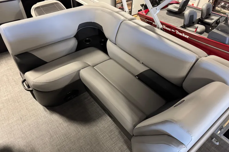Slide: The Image of 2026 Sun Tracker SportFish 20 DLX boat interior with plush gray seating. - 8