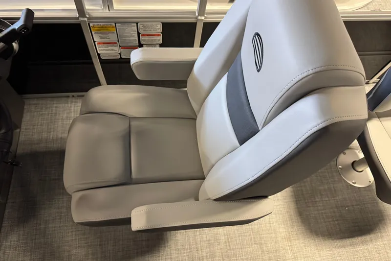 Slide: The Image of 2026 Sun Tracker SportFish 20 DLX boat seat, featuring gray upholstery and armrests. - 9