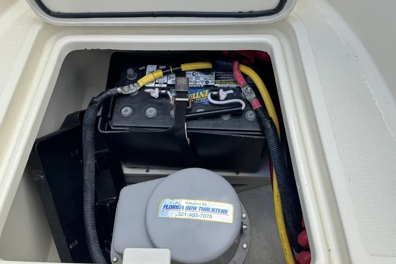 Slide: The Image of Battery compartment of 2023 Chris-Craft Catalina 30 boat with wiring and components. - 10
