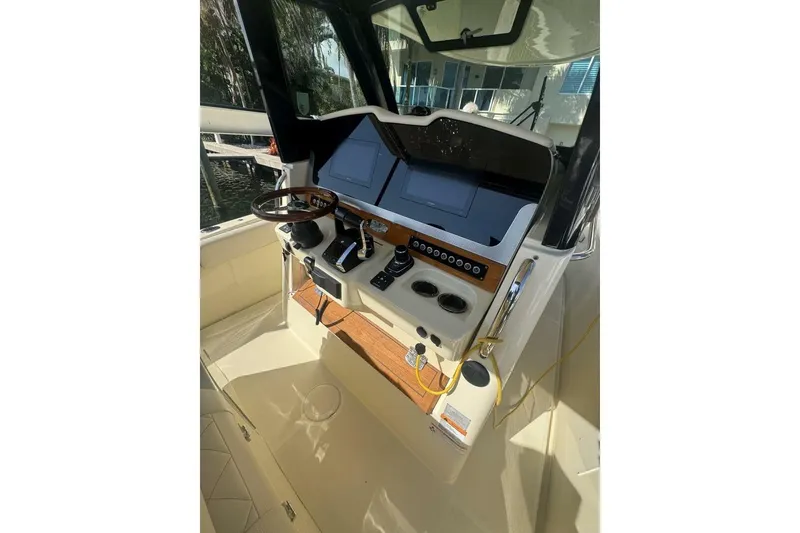Slide: The Image of 2023 Chris-Craft Catalina 30 anchor compartment with teak decking and open hatch. - 11