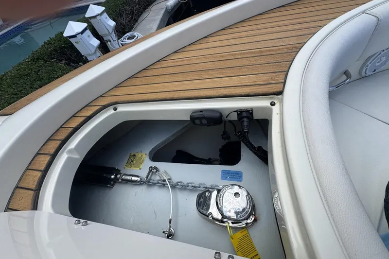 Slide: The Image of 2023 Chris-Craft Catalina 30 anchor compartment with teak decking and chain mechanism. - 12