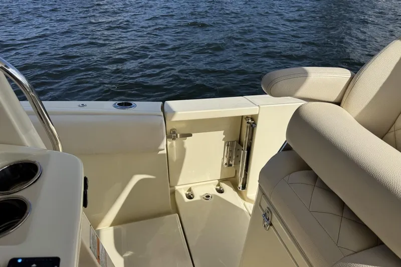Slide: The Image of 2023 Chris-Craft Catalina 30 boat interior with beige seating and ocean view. - 5